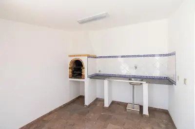 a bathroom with a sink and a toilet at Villa Brisa do Mar in Galé