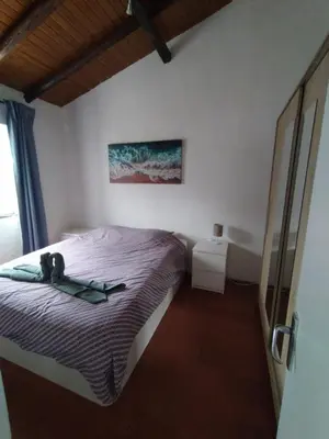 a bedroom with a bed and a bath tub at Pérola de Sandy in Paderne