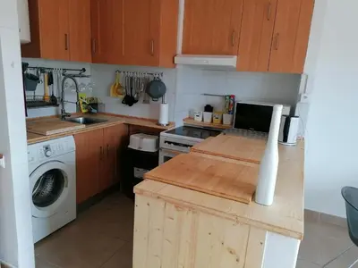 a kitchen with a sink and a washing machine at Old Village Vilamoura in Quarteira