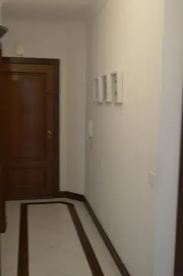 a hallway with a door and a room with a floor at Apartamento próximo da Marina Vilamoura c/piscina e estacionamento in Vilamoura