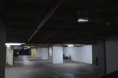 an empty parking lot in a parking garage at Apartamento próximo da Marina Vilamoura c/piscina e estacionamento in Vilamoura