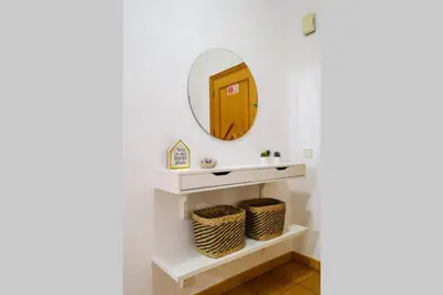 a bathroom with white shelves and a mirror at AL-Dream Oura Estrela Apartments - CC in Albufeira