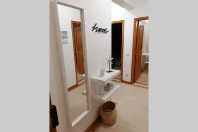 a bathroom with a mirror and a sink at AL-Dream Oura Estrela Apartments - CD in Albufeira