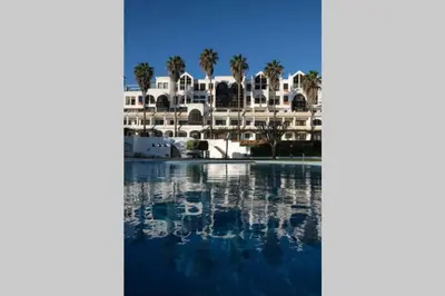 a view of a resort with palm trees and a swimming pool at AL-Dream Oura Estrela Apartments - CD in Albufeira