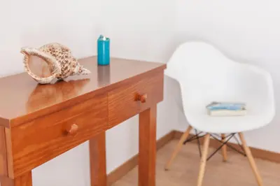 a wooden desk with a white chair next to it at Villa Abel by Algarve Vacation in Albufeira