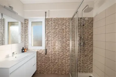 a bathroom with a shower with a glass door at #012 Exclusivo para Famílias, Habijovem by Home Holidays in Albufeira
