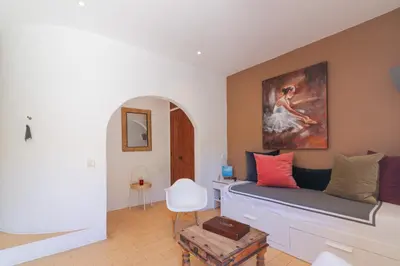 a kitchen with white cabinets and a counter top at Casa felix in Loulé