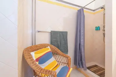 a bathroom with a toilet and a sink and a mirror at Casa felix in Loulé