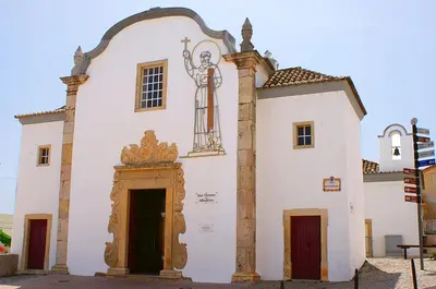 a church with a statue on the side of it at Villa Amendoeiras 52 in Albufeira