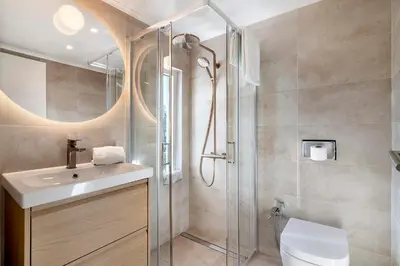 a bathroom with a sink and a shower at Apartment Dansk in Almancil