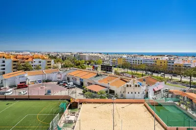 an aerial view of a city with a soccer field at LovelyStay - Bela Vista 3BDR Duplex Penthouse with Pool in Albufeira