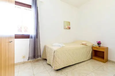 a room with a small table and a window at Villa Altis by Villa Plus in Albufeira