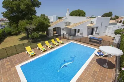 a swimming pool with a dolphin painted on it in a house at Villa Elo by Villa Plus in Albufeira