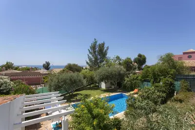 a view of the pool from the balcony of a house at Villa Emilio Pequena by Villa Plus in Albufeira