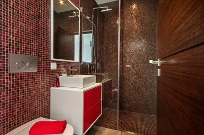 a bathroom with a toilet and a sink and a shower at Villa Eve by Villa Plus in Olhos de Água