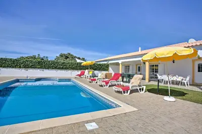 a villa with a swimming pool and a house at Villa Miguel by Villa Plus in Galé