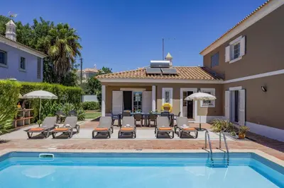 a villa with a swimming pool and a house at Villa Teotel by Villa Plus in Almancil