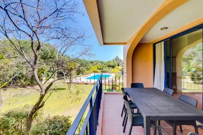 a table and chairs on a balcony with a view at AL - Apartamento Vila Sol F5 AA in Vilamoura