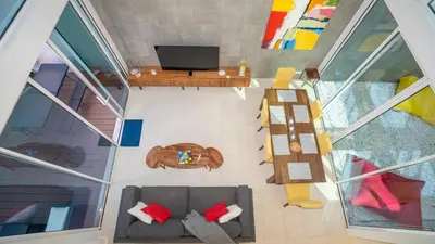 an overhead view of a living room with a couch at Central Vilamoura Townhouse in Quarteira