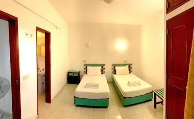 a bedroom with two beds in a room at The Central Guesthouse in Faro