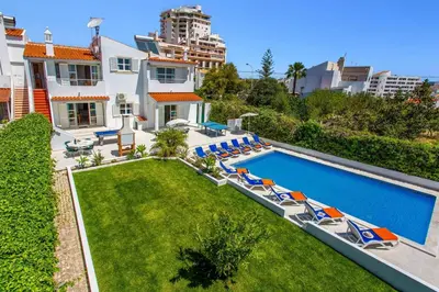 an aerial view of a house with a swimming pool and lawn at Villa Animado by Villa Plus in Albufeira