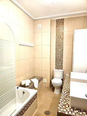 a bathroom with a toilet and a tub and a sink at Albufeira Old Town T3 with Balcony in Albufeira