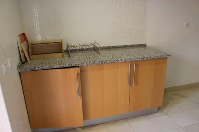 a kitchen with a counter top and a counter top at Charming 3-Bed Apartment in Albufeira in Albufeira