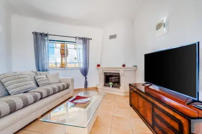 a dining room with a table and chairs at Villa Rafaela com piscina Albufeira in Albufeira