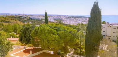 a view of a city with trees and buildings at Ocean View - Fantástico Studio em Albufeira in Albufeira