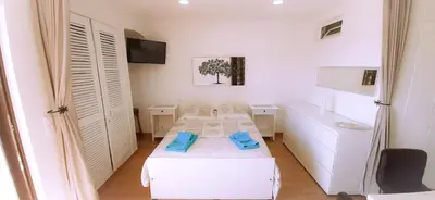 a room with two beds in a room with at Ocean View - Fantástico Studio em Albufeira in Albufeira
