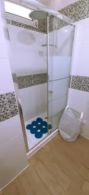 a shower with a glass door in a bathroom at Ocean View - Fantástico Studio em Albufeira in Albufeira