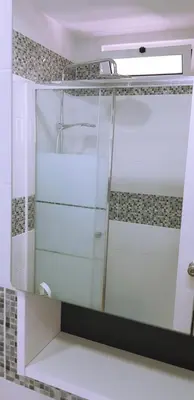 a mirror in a bathroom with a shower at Ocean View - Fantástico Studio em Albufeira in Albufeira