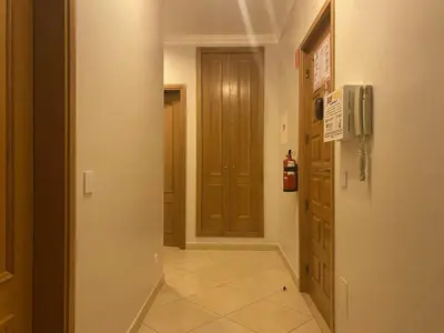 a hallway with a door leading to a room at BayView Albufeira in Albufeira