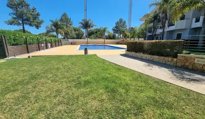 a swimming pool in a yard next to a building at Quinta do Pinheiro Premium by Sunny Deluxe in Olhos de Água