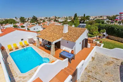 an image of a villa with a swimming pool at Villa Aveiros by Villa Plus in Albufeira