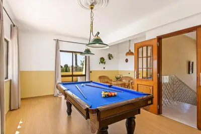 a billiard room with a pool table in a house at Villa Barreto by Villa Plus in Pêra