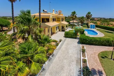 an aerial view of a house with a swimming pool at Villa Barreto by Villa Plus in Pêra