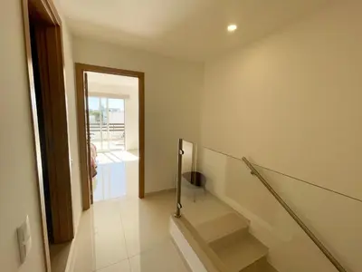 a room with a staircase with a glass railing at Casa Rosa - Vilamoura in Vilamoura