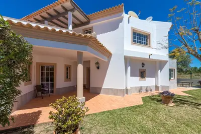 a large white house with a yard at Villa Nox in Brejos