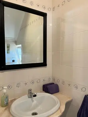 a bathroom with a sink and a mirror at Villa Nox in Brejos