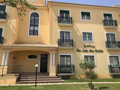a building with a sign on the front of it at Oura Beach T1 apartment Coral , close to the Strip, Swimming Pool, Wi Fi, A/C in Albufeira