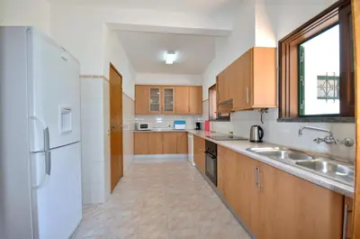 a driveway leading to a house with a tree at Close to Beaches and All Amenities, Private Pool, Free AC and Wifi in Quarteira