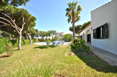 a house with a swimming pool in a yard at Close to Beaches and All Amenities, Private Pool, Free AC and Wifi in Quarteira