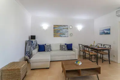 a living room with a couch and a table at Refugio Salgados in Galé