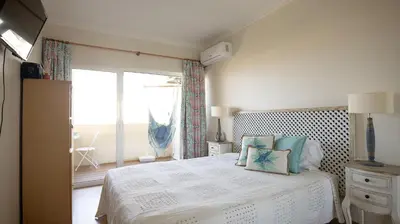 a bathroom with a toilet and a sink at Palmeira Gale - WIFI - Pool - Lux - BY BEDZY in Albufeira