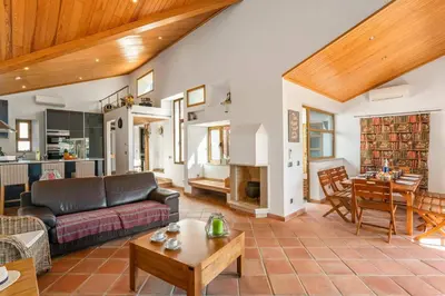 a living room with a couch and a table at Villa Casa Tina by Villa Plus in Albufeira