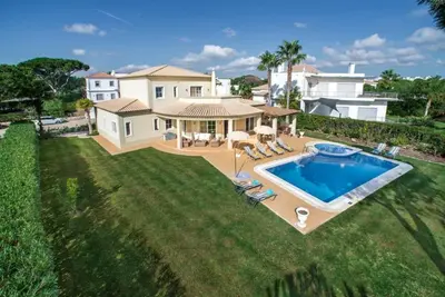 an aerial view of a house with a swimming pool at Villa Palm Golfe, fantastic house on Vila Sol course, kids pool, aircon in Quarteira