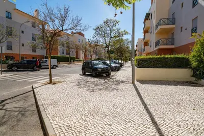 a car parked on the side of a street at Corcovada in Albufeira