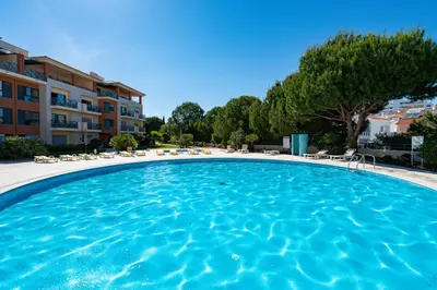 a large swimming pool in front of a building at Corcovada in Albufeira