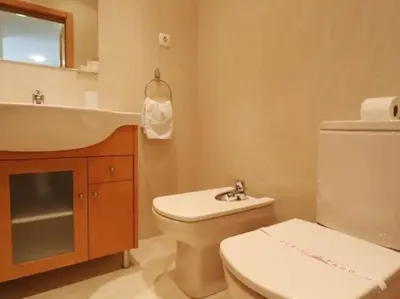 a bathroom with a toilet and a sink at Happiness Apartment by Stay ici Algarve Holiday Rental in Albufeira